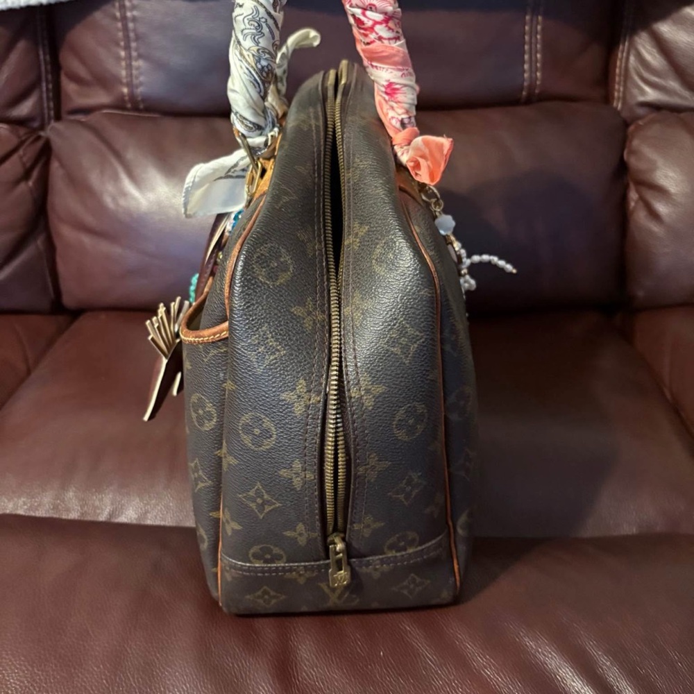 Brown Designer Handbag With Patterned Accents - image 3